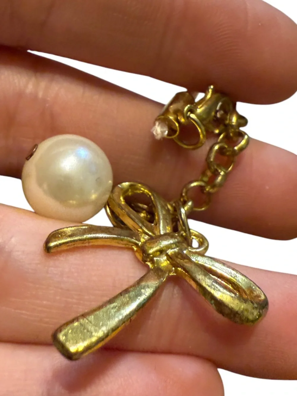 BENEIGE handmade bow and pearl bag charm featuring a gold-toned bow accent